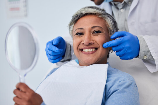 Happy dentist with patient